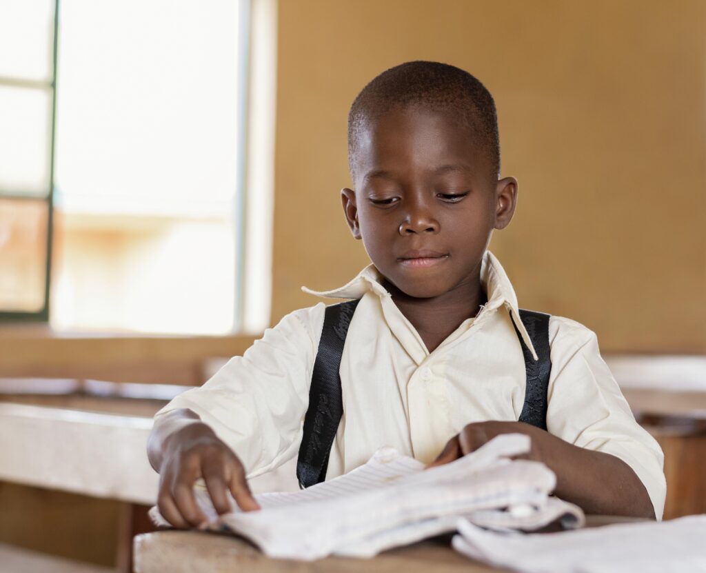 african-kid-learning-class